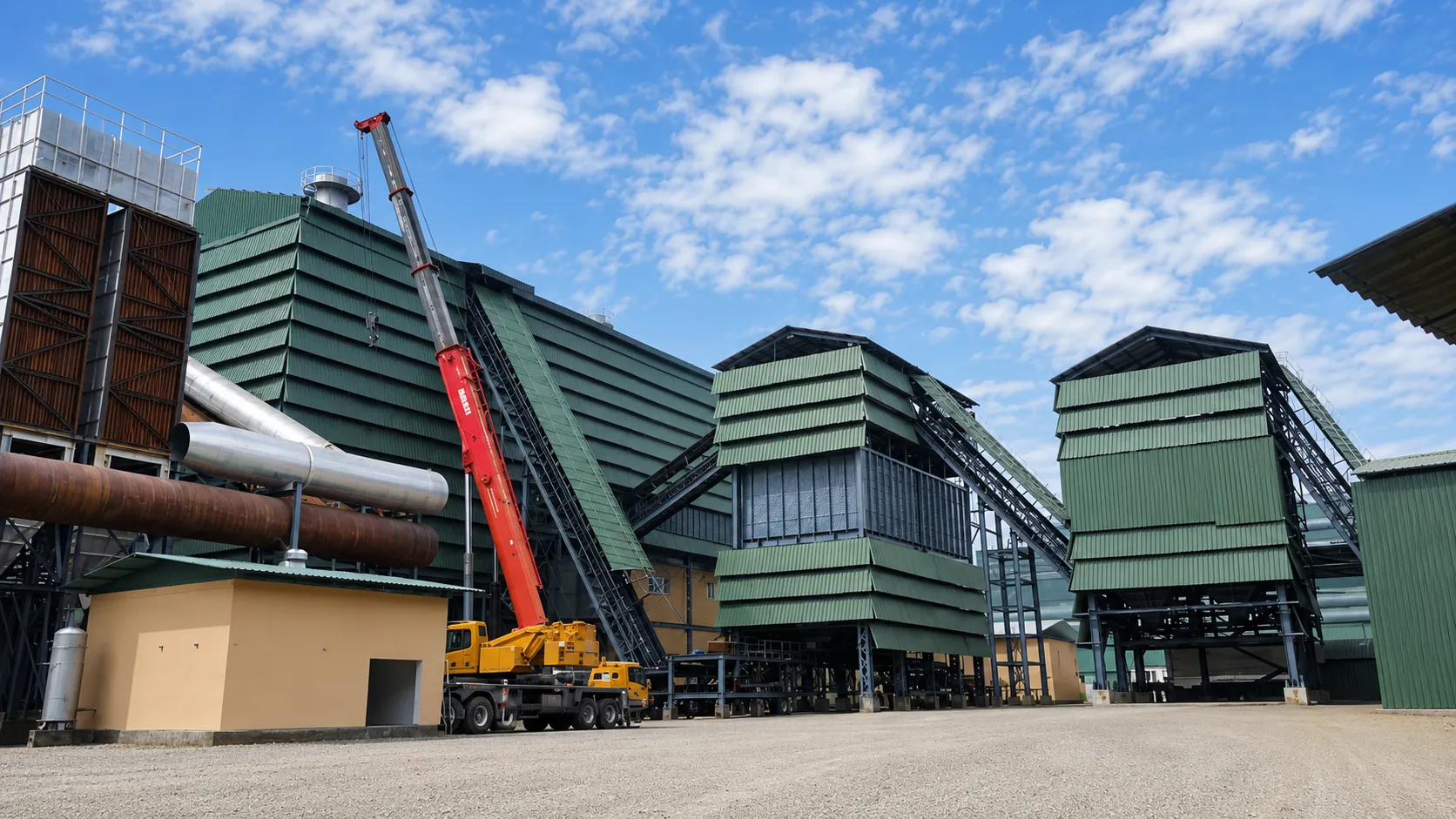 Aja Alloys plant yard with production buildings and mobile crane